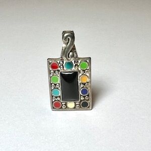 Metal necklace pendant with colored circles